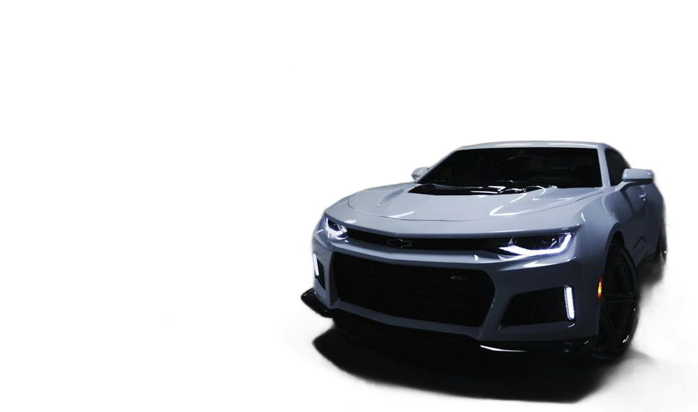A silver sports car in an indoor showroom, background removed