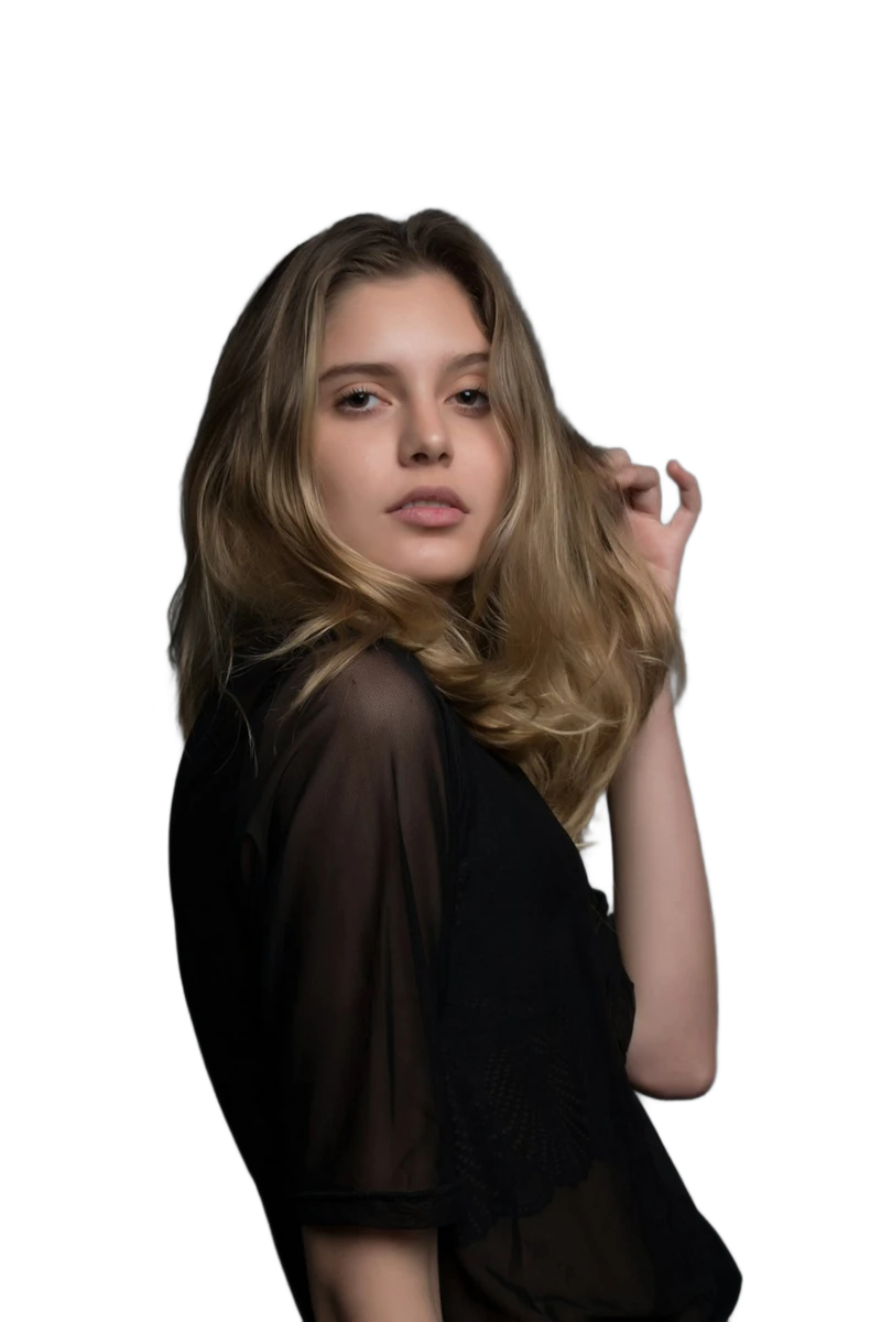 A woman with flowing hair against a dark backdrop, background removed